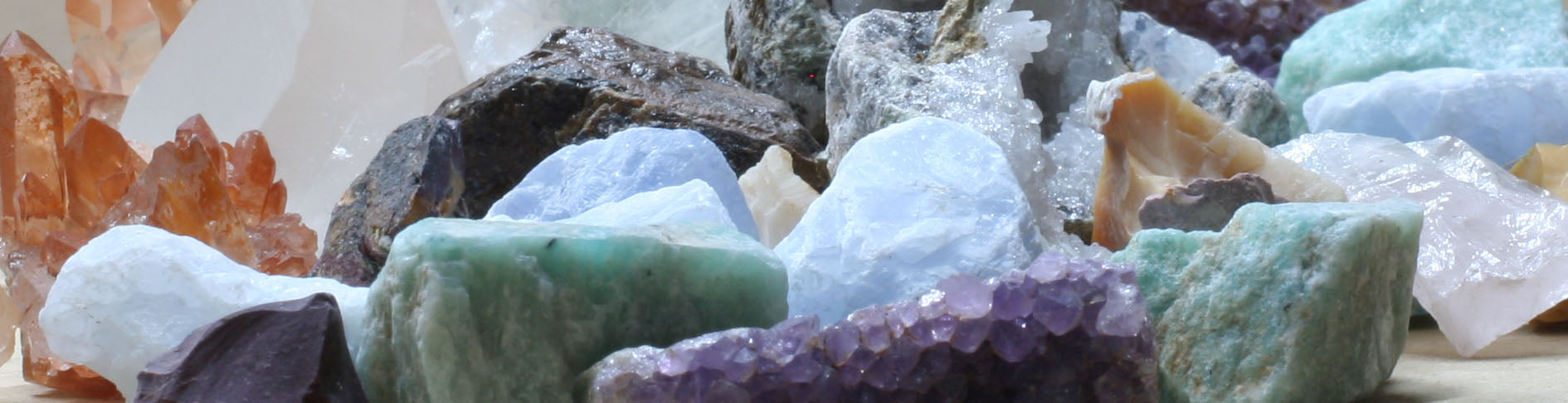 A collection of colorful crystals and minerals arranged together. Calm, grounding, and slightly chaotic, just like letting go.