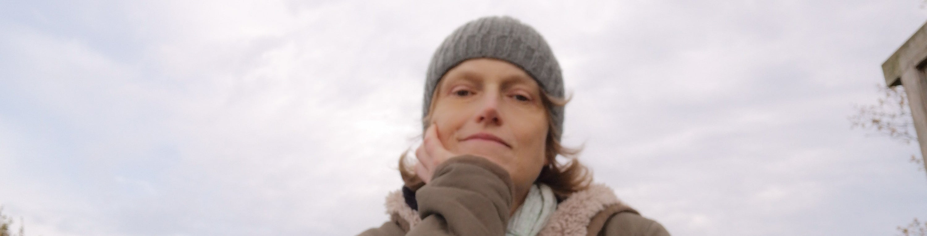 Portrait of Maartje, calm and thoughtful under a soft winter sky. A quiet visual companion to her reflections on healing, creativity, and the stories we carry.