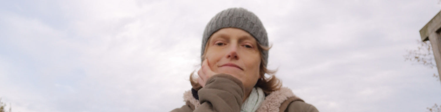 Portrait of Maartje, calm and thoughtful under a soft winter sky. A quiet visual companion to her reflections on healing, creativity, and the stories we carry.